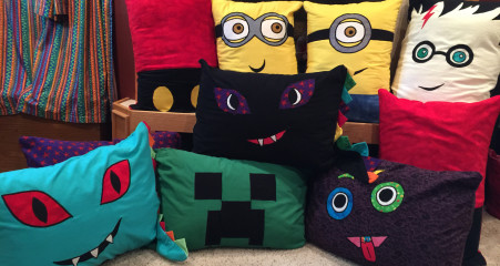 We dropped off some Reading Pillows for the little guy's classroom today. This year's assortment includes Harry Potter, dragons, monsters, Minions, Mickey Mouse and a Minecraft Creeper. (=